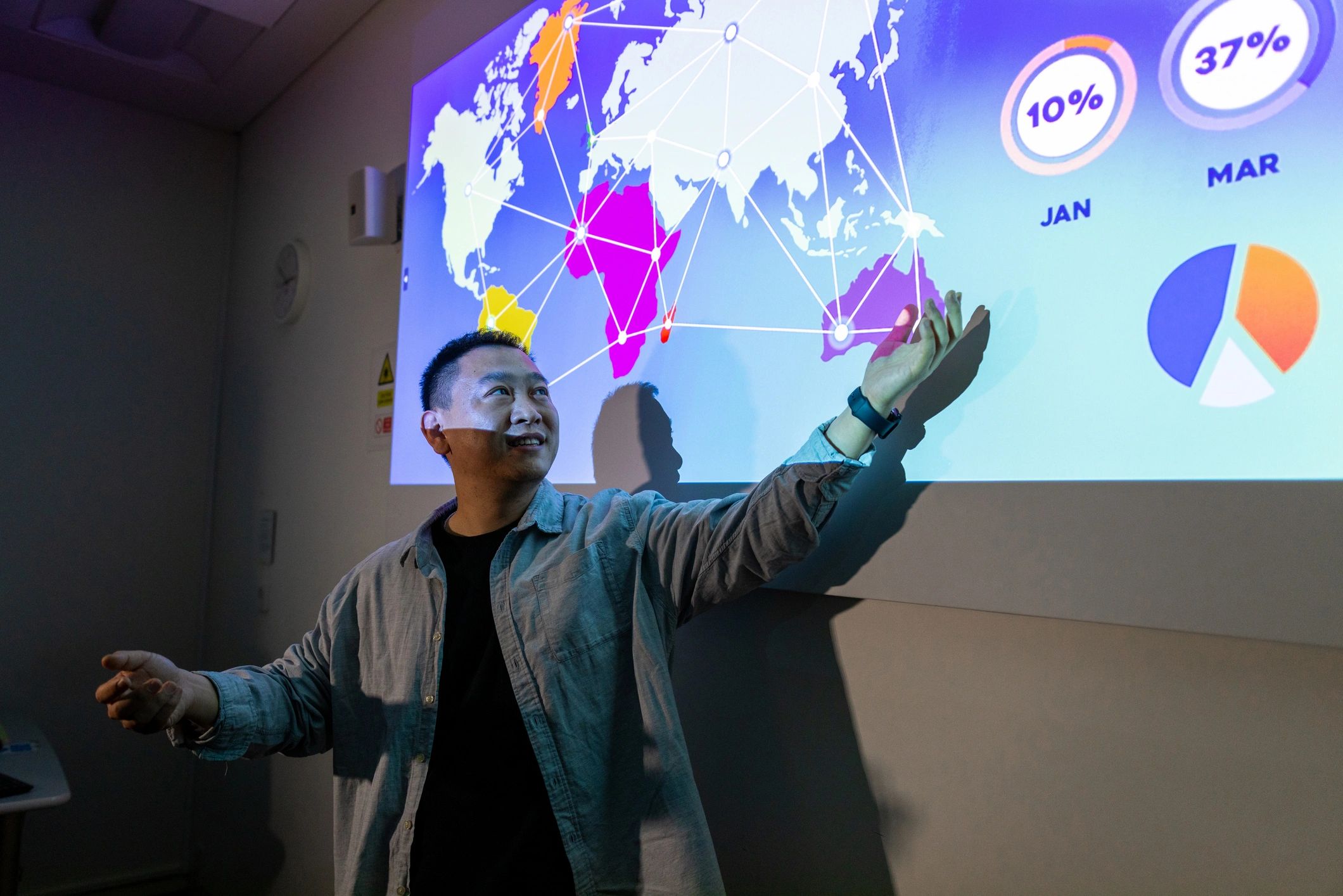 Instructor pointing at a projected screen, representing learning terminology