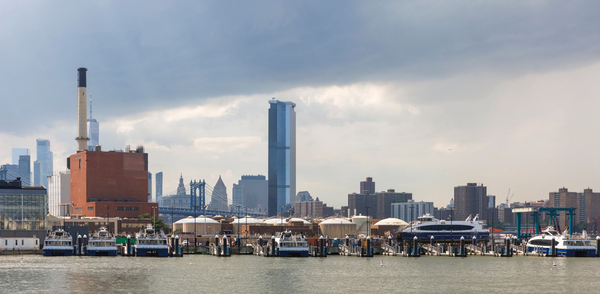 City skyline under dramatic storm clouds